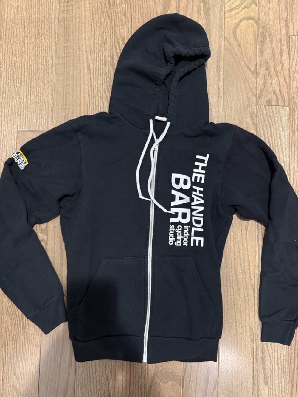Black “The Handle Bar” Zip-Up Hoodie with White Logo and yellow logo on sleeve